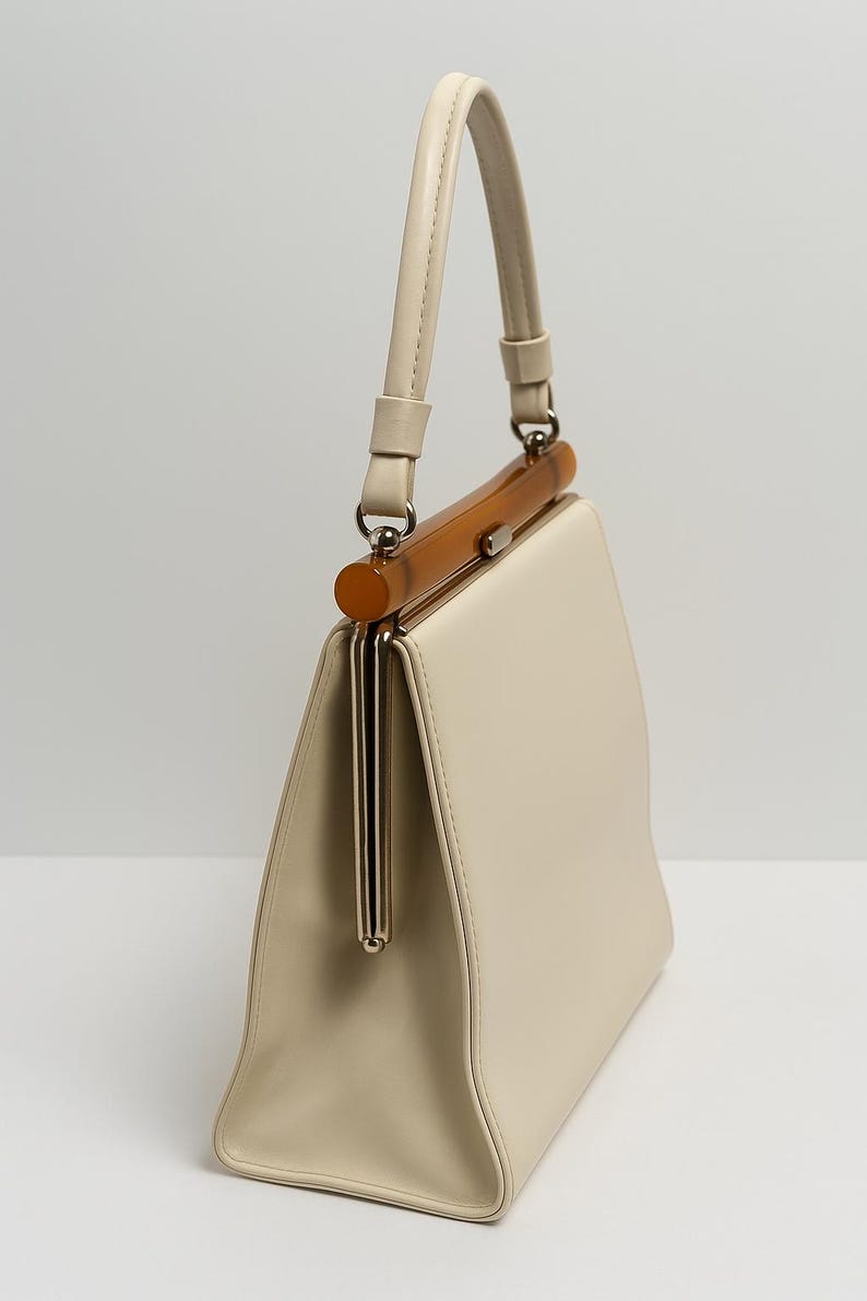 1960s Theodore of California Cream Faux Patent Leather Handbag Amber Frame Vintage Purse